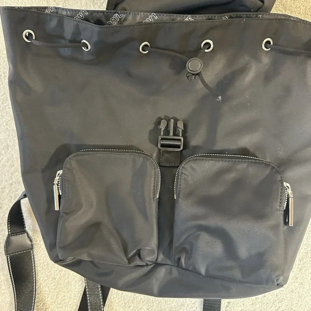 Lacoste Women's Solid Black Cinch Flap Nylon Bag Backpack